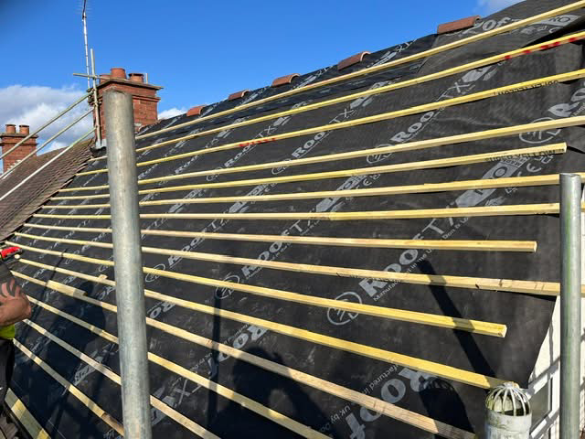 Full re-roof in progress showing fresh battens and breathable membrane installed across the roof